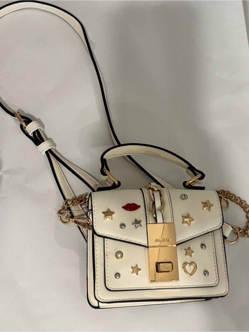 ALDO Cream Mini Crossbody with Gold Hardware and Red Lip Accent